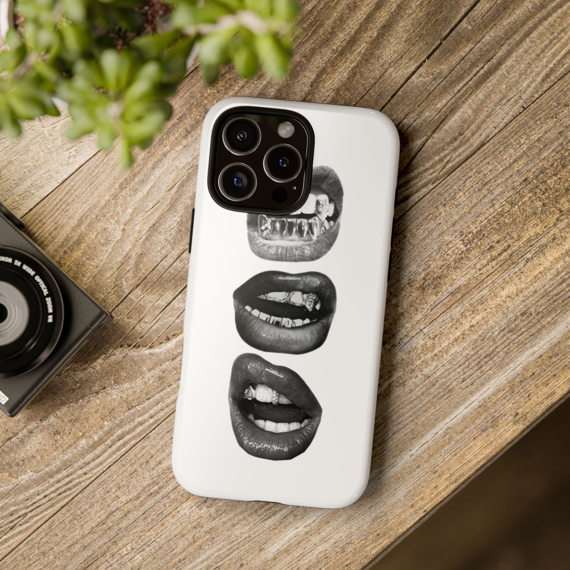 Edgy bite me grillz lips iPhone tough case with stacked black glossy lips biting and silver teeth grills Y2K aesthetic
